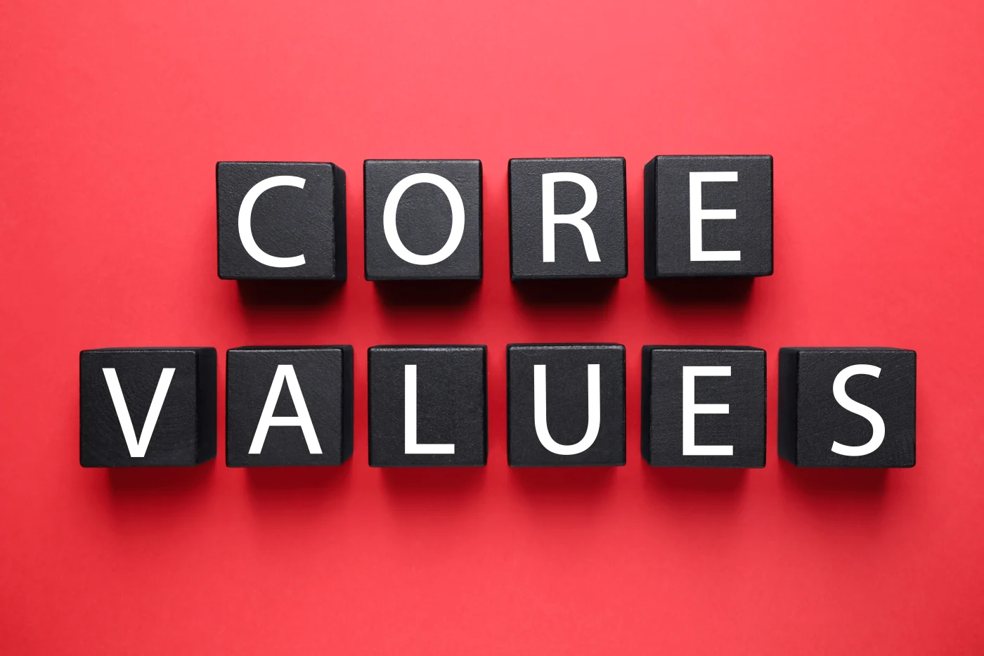 Blocks with a red background spelling Core Values