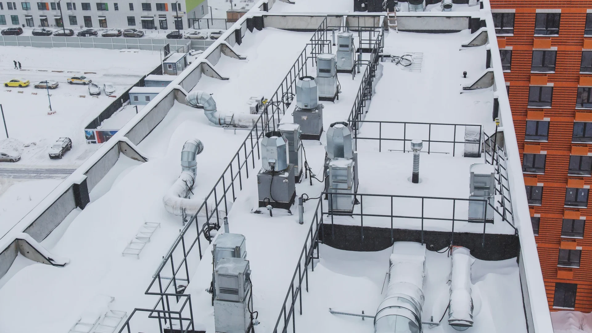 Snow on the roof of an apartment building