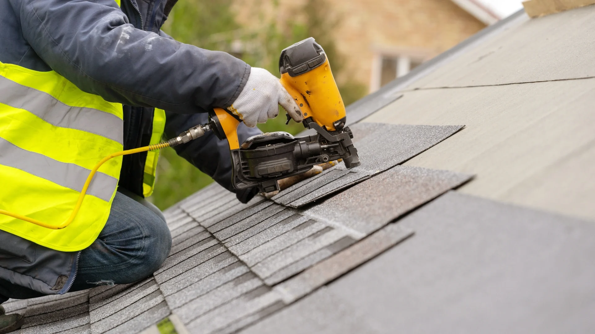 Workers performing roofing repairs on a commercial building