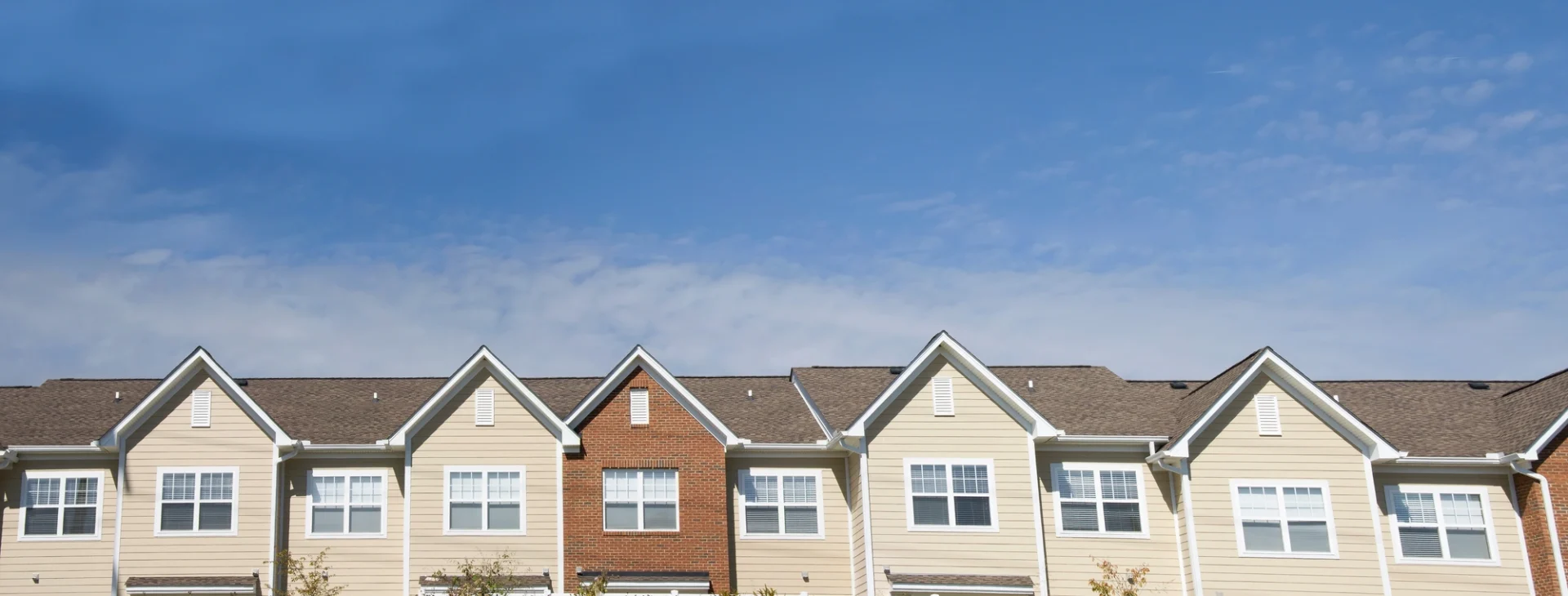 There is an up-close of the roof of a multi-family unit.