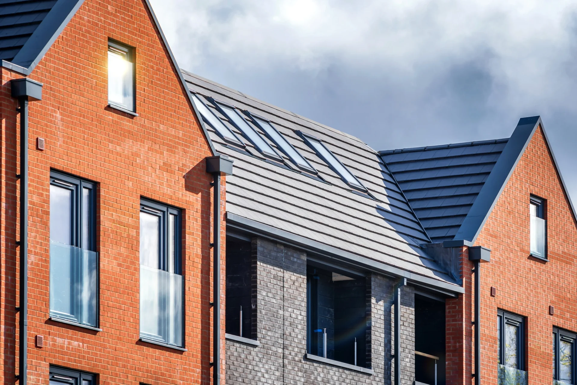 There is a black roof on an orange building