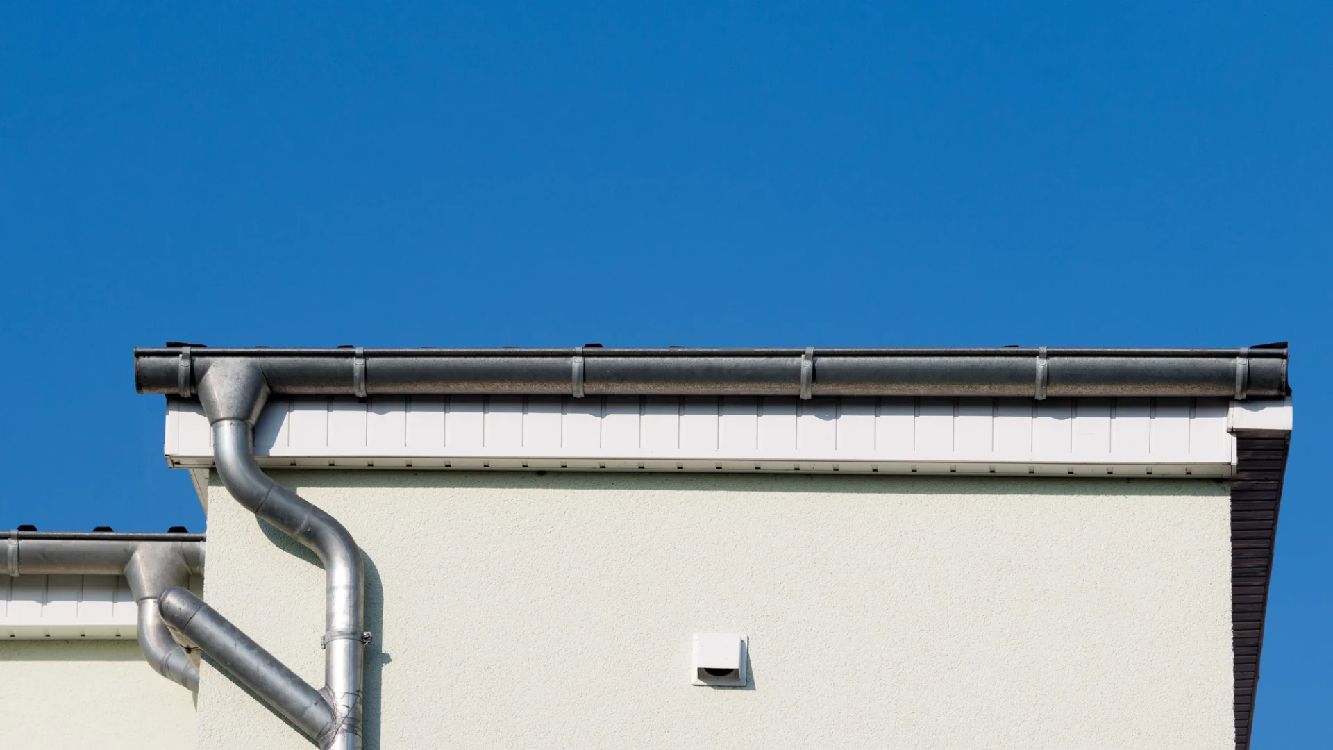 Side view of a gutter system on a commercial building