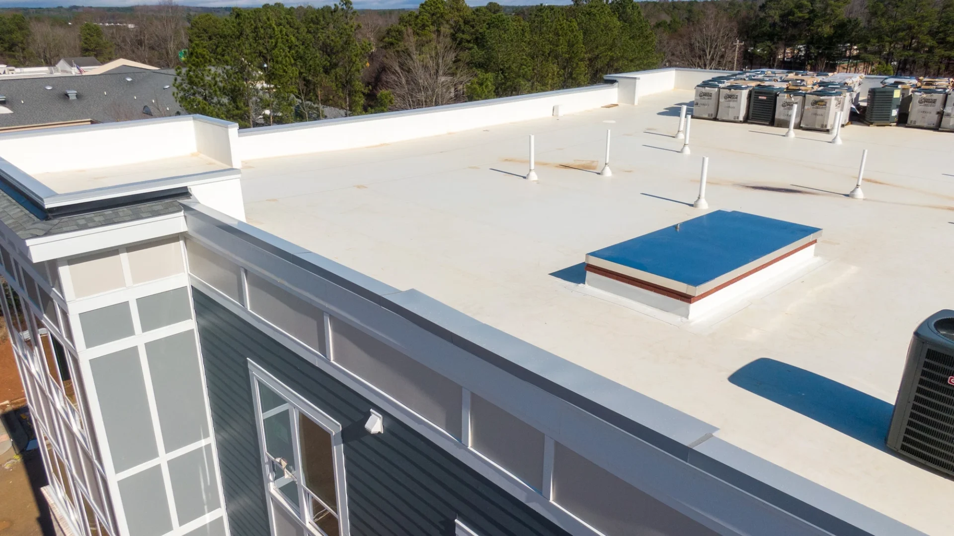 Overhead view of a flat roof on an apartment complex