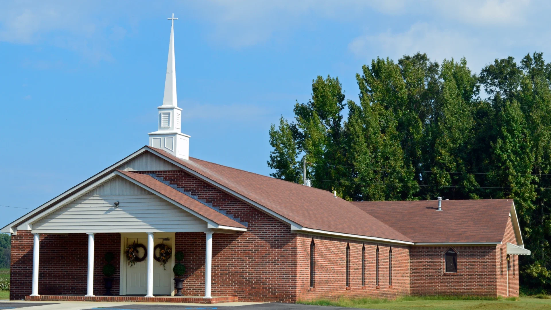 Church building with shingles on roof