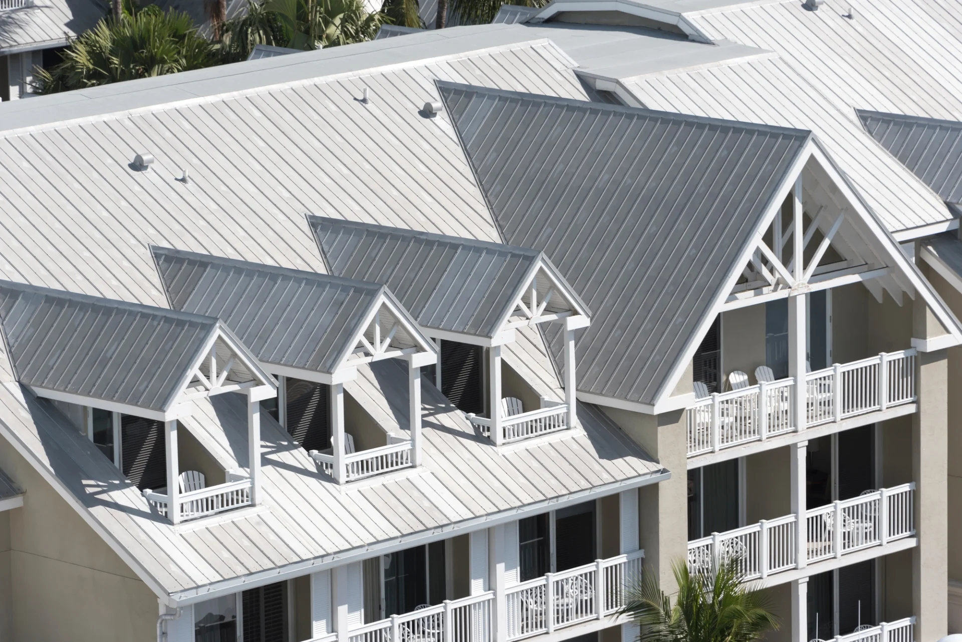 There is a white roof on a condominium complex