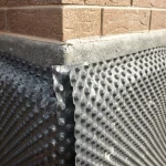 Waterproofing materials being installed on a business in Hudson County by 1 Call Restore