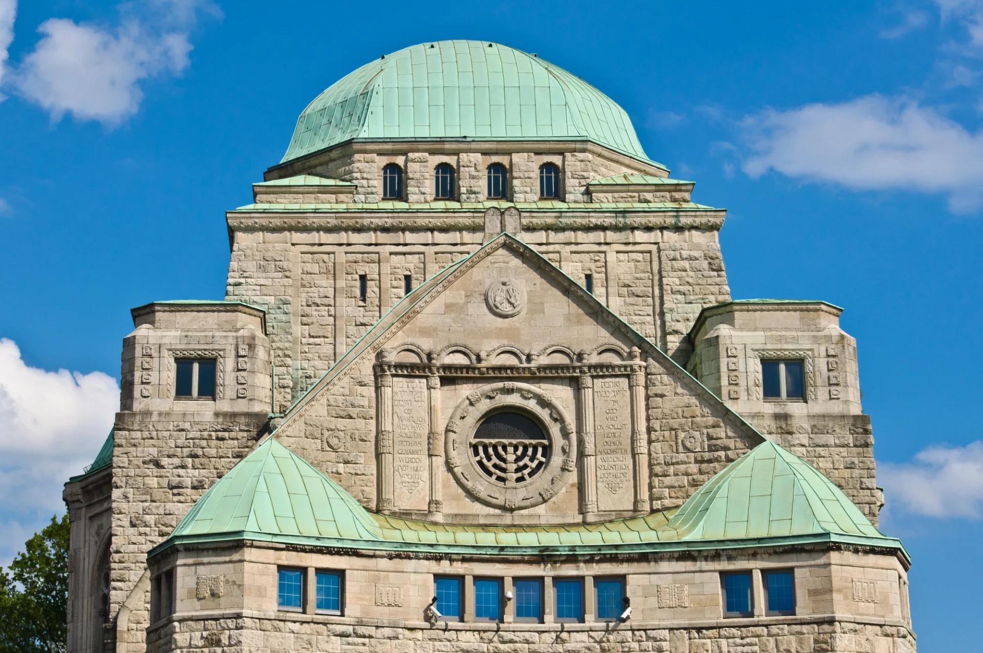 There is a synagogue with a green roof.