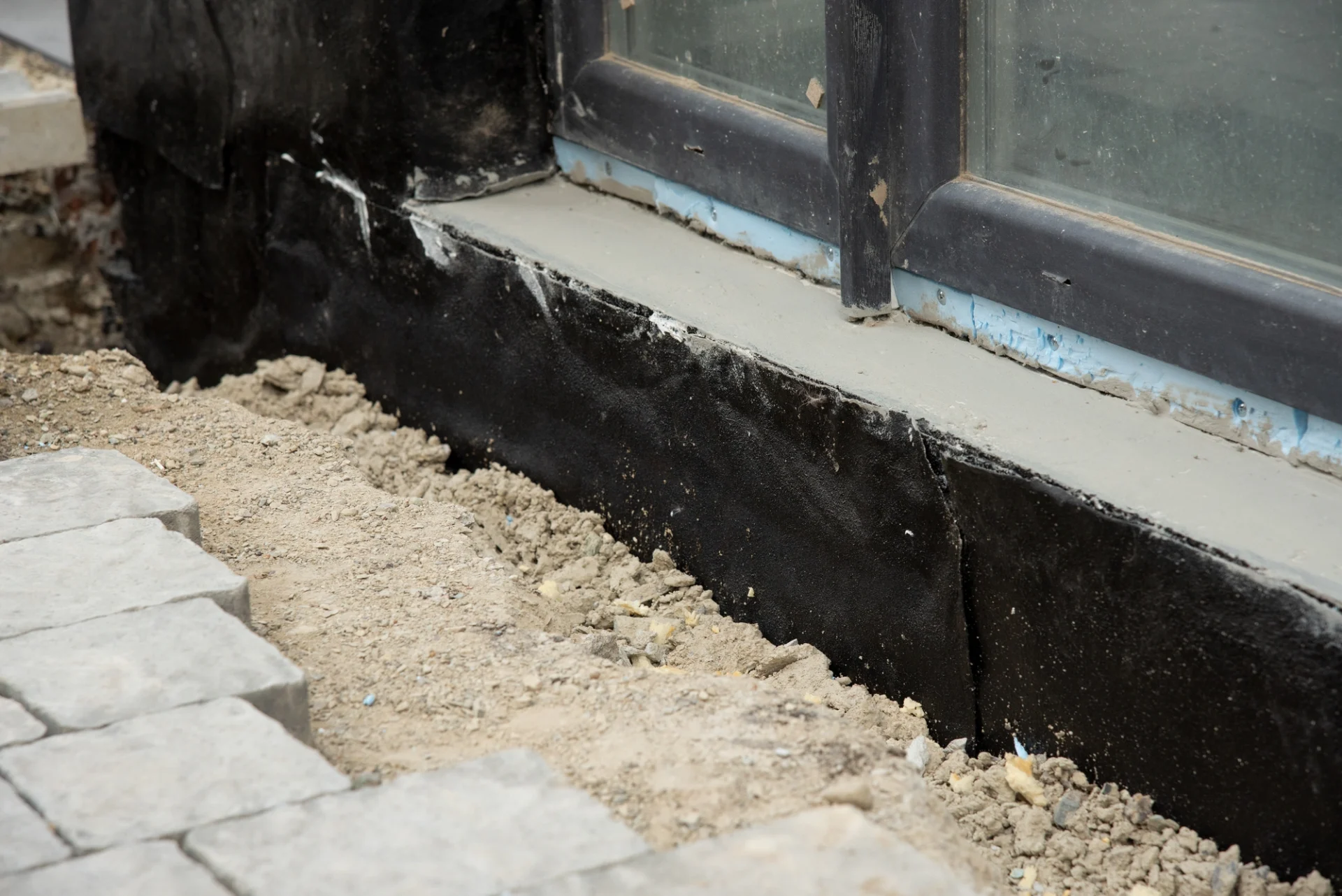 Waterproofing wrap around the exterior footing of a building’s foundation