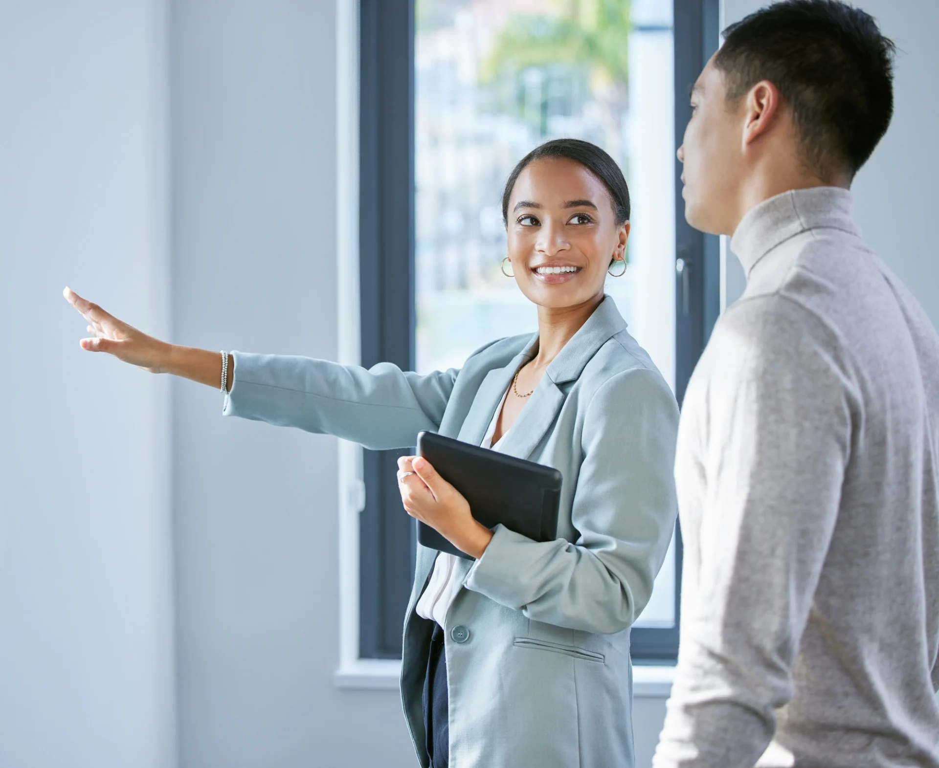 A realtor showing property to a prospective client